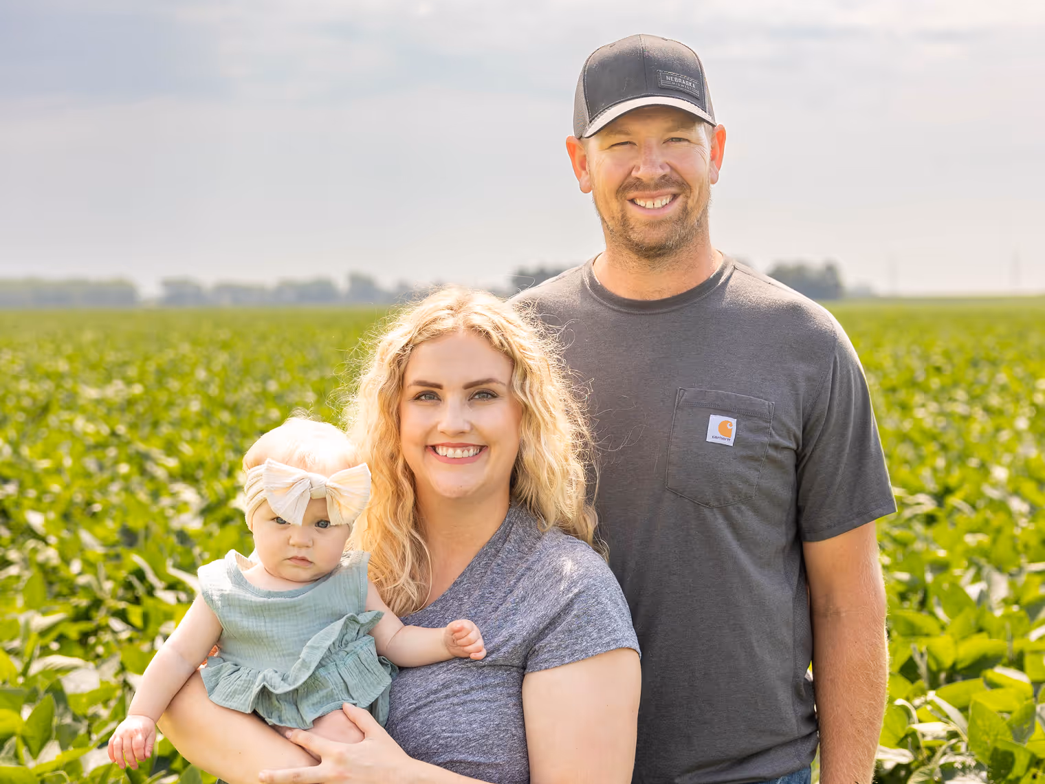 Family picture of a man, woman, and baby