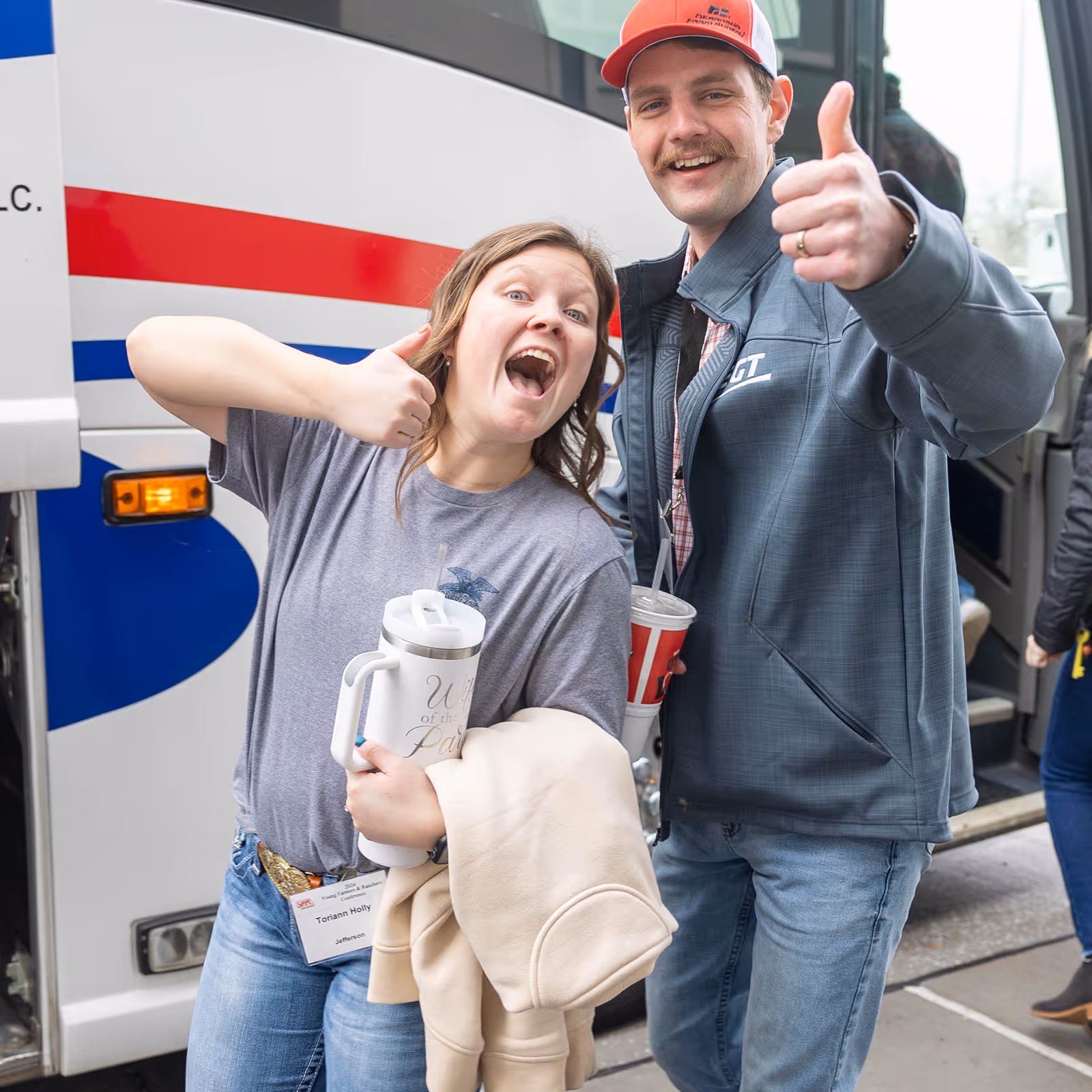 Man and woman giving a thumbs up