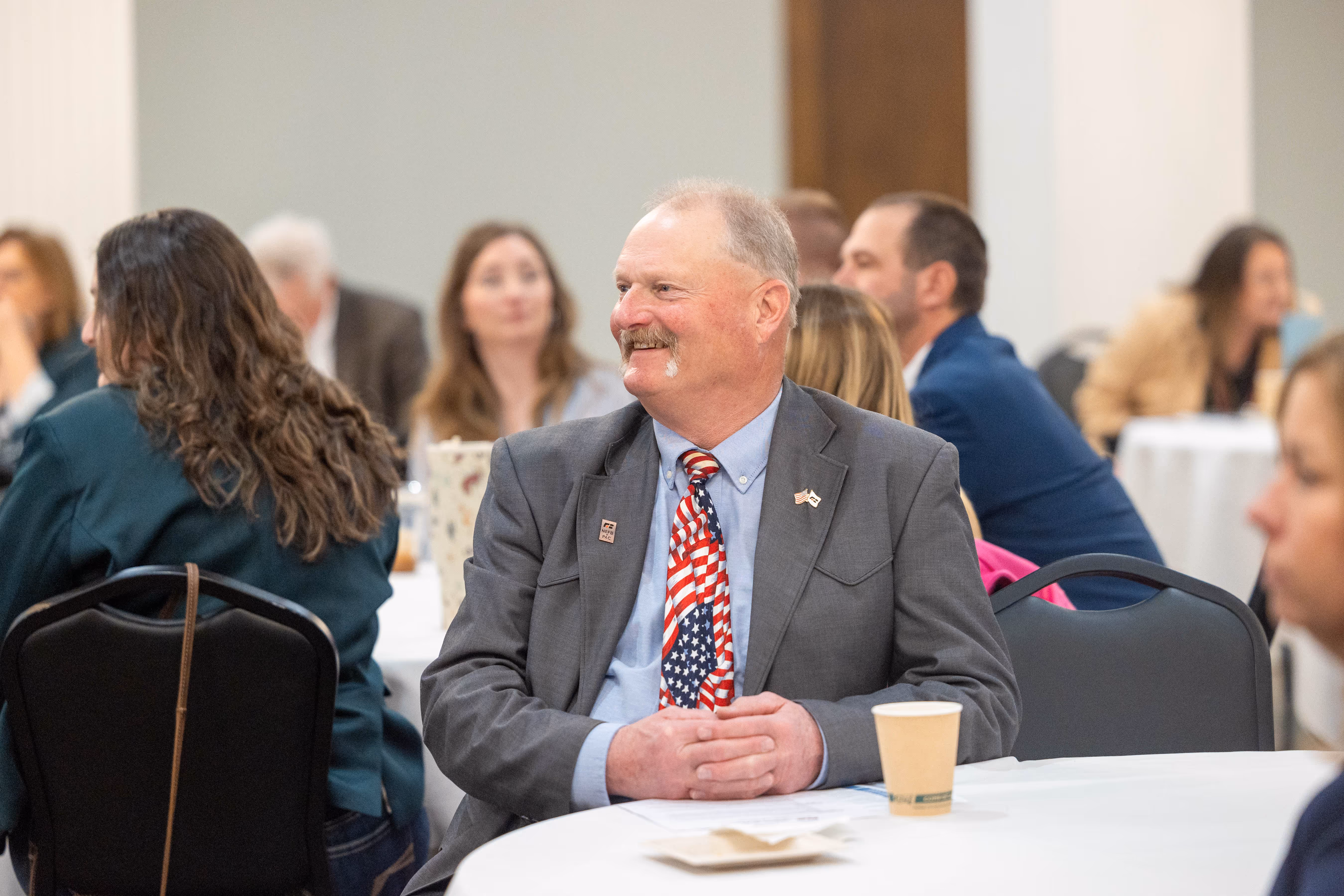 People sitting at round tables