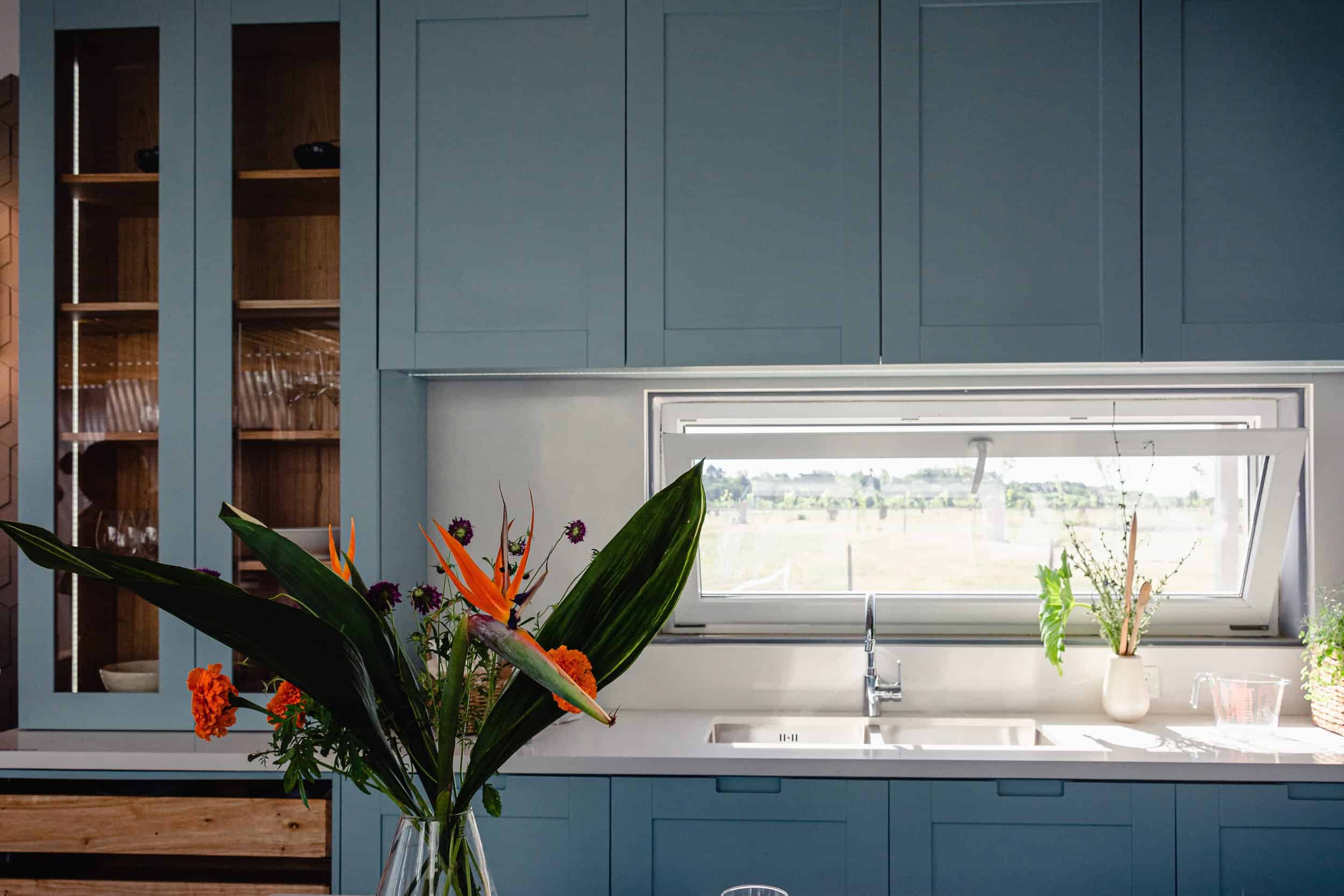 modern kitchen with bright cabinets and sleek stone countertops