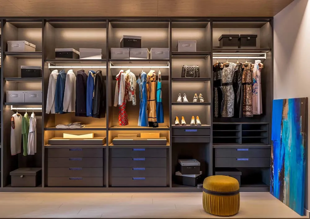 modern walk-in closet with light up accents