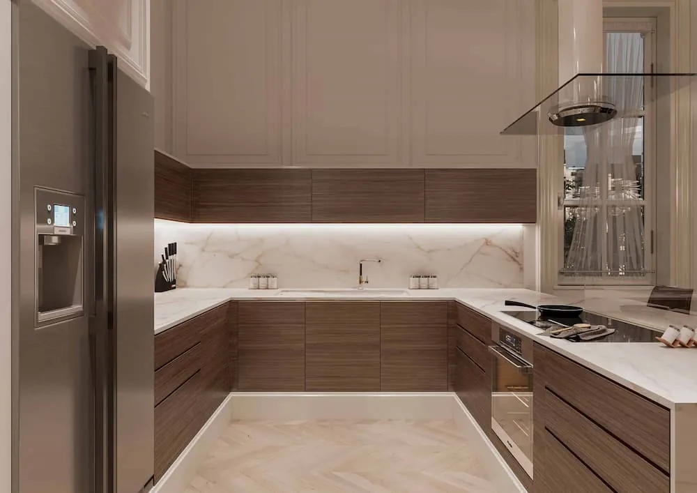 modern kitchen with warm wood cabinets and marble countertops and backsplash