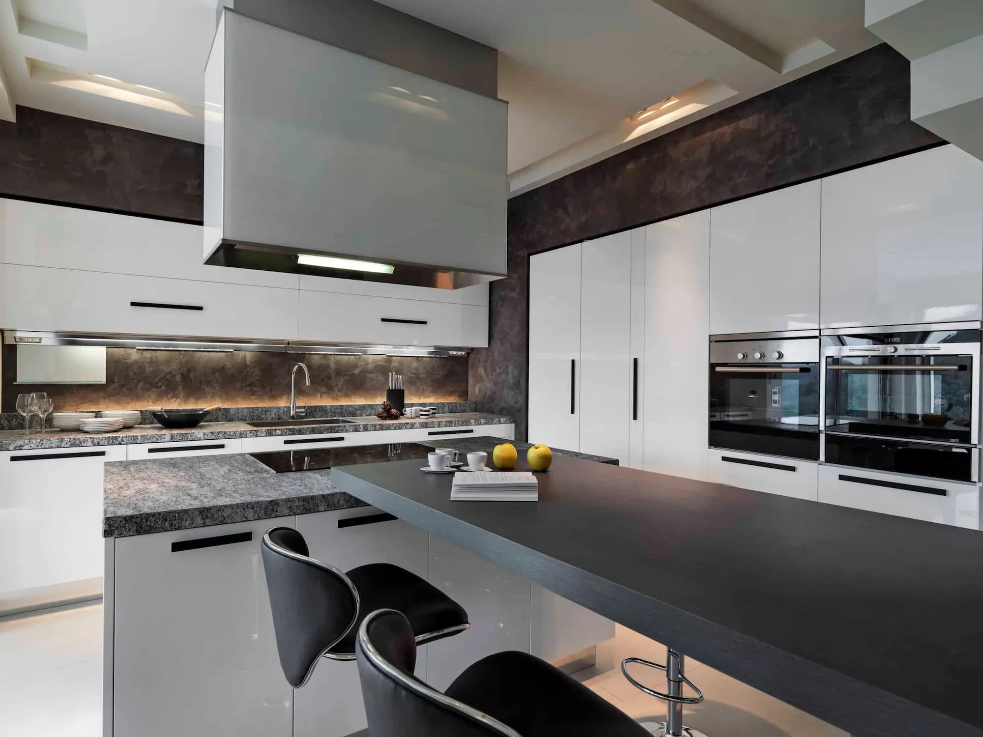 modern kitchen with sleek cabinets and stone countertops
