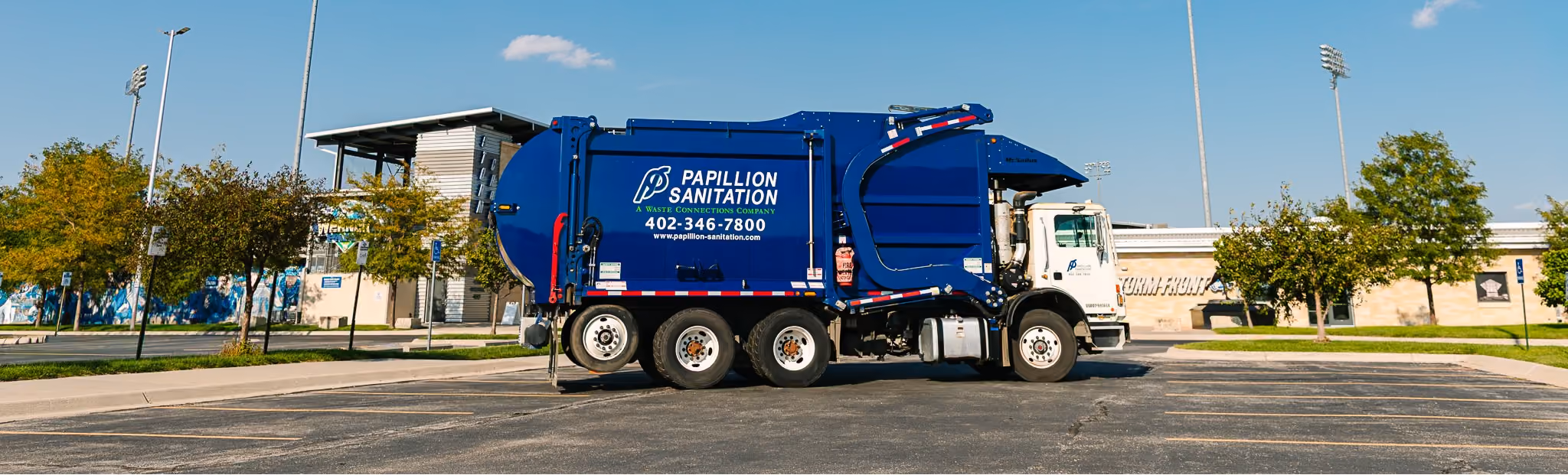 Commercial front-load garbage truck used for business waste collection