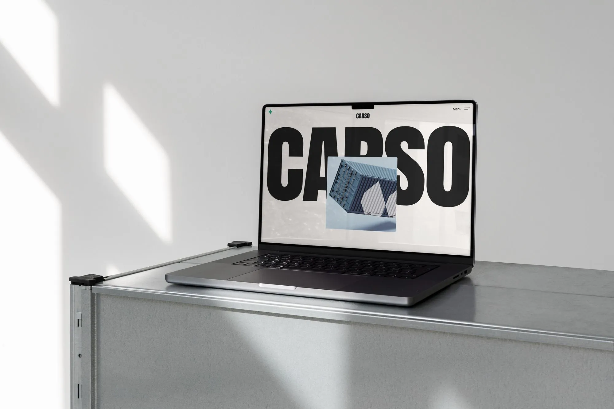 A laptop computer sitting on top of a metal table.
