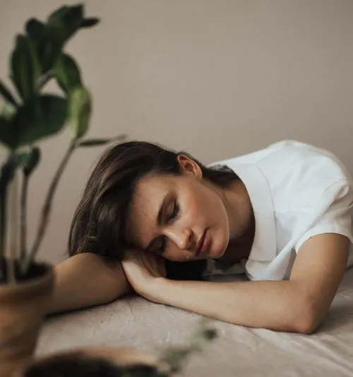 woman resting on a table