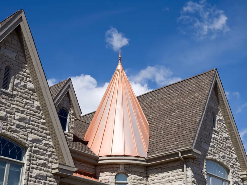 dream house with copper roof turret