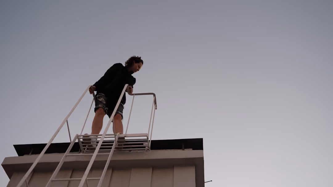 professional installer on a ladder for a multi-story home - gutter downspout installation cost professional installer on a ladder for a multi-story home - gutter downspout installation cost