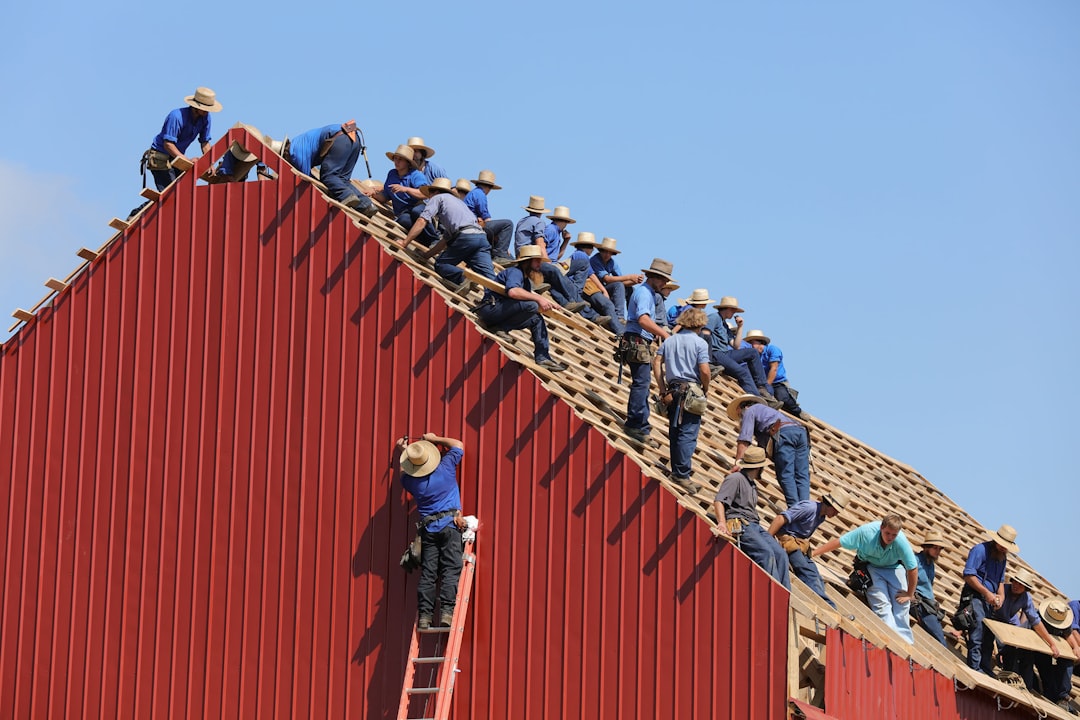licensed roofing crew installing metal panels licensed roofing crew installing metal panels