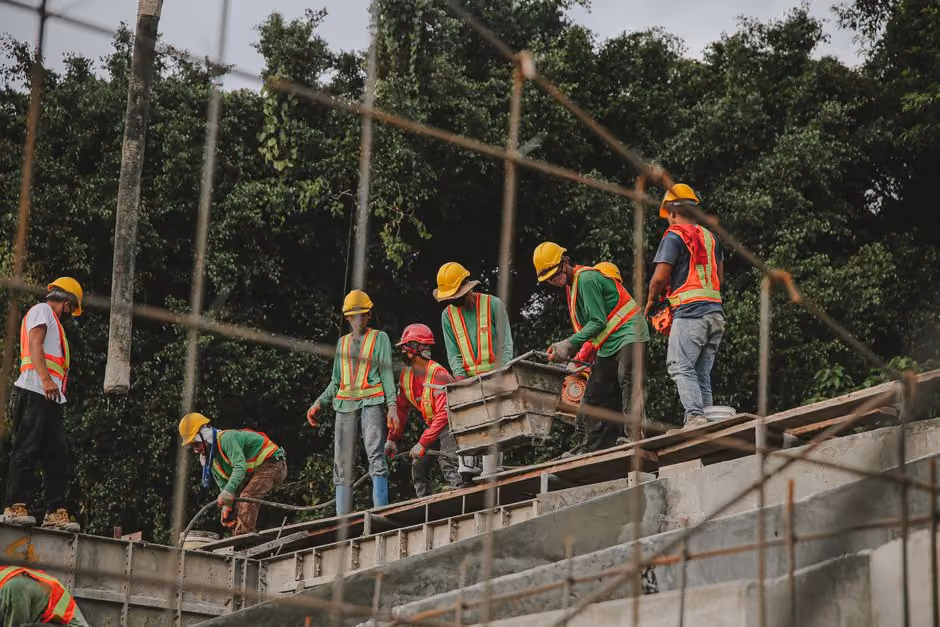 commercial roofing crew working safely on flat roof commercial roofing crew working safely on flat roof