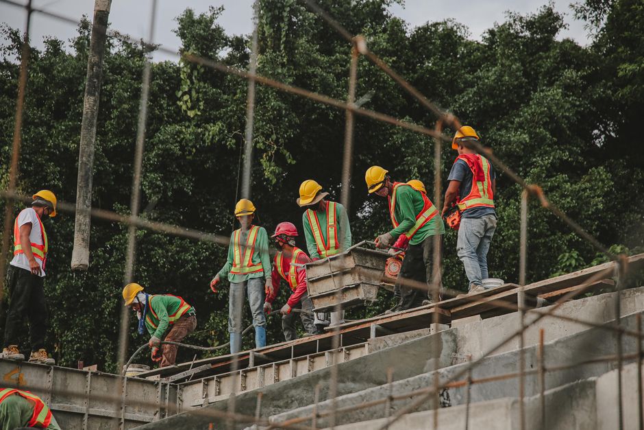 commercial roofing crew working safely on flat roof commercial roofing crew working safely on flat roof
