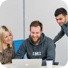 Startup founders engaging in mentorship session, showcasing DMZ’s incubator and accelerator support systems.