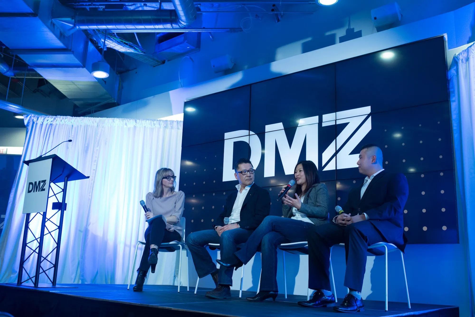 Panel discussion at DMZ event with speakers on stage, representing DMZ’s global expansion and the launch of Canada’s first Black Innovation Programs.