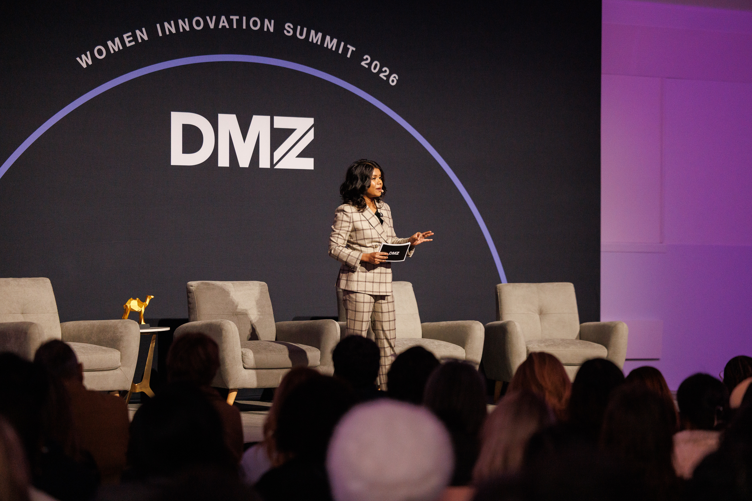 A women entrepreneur pitching on stage at the DMZ Women Innovation Summit 2026