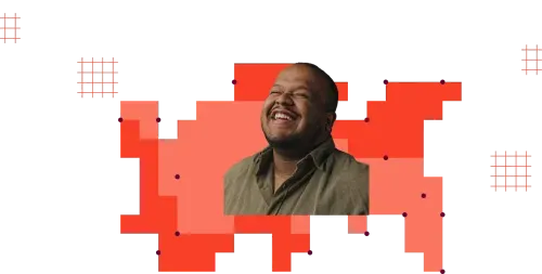 Smiling man with a beard wearing an olive green shirt against red and orange pixelated abstract background.