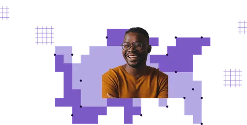 Smiling man with glasses wearing a mustard yellow shirt against a background of purple and lavender geometric shapes.