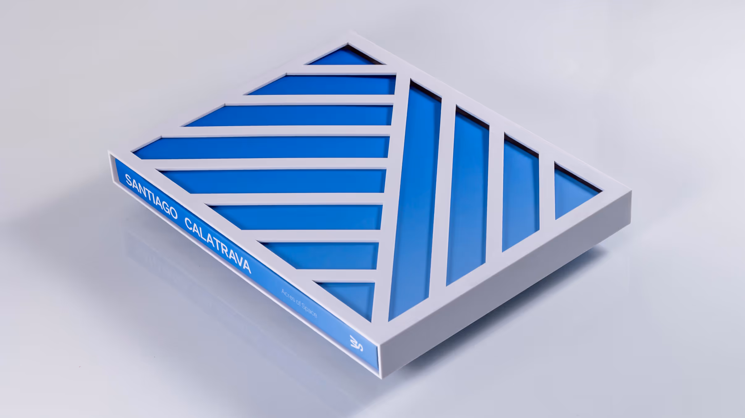 Book in slipcase lying down on surface.