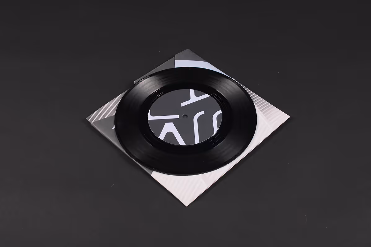 Folded poster into vinyl packaging with vinyl over.