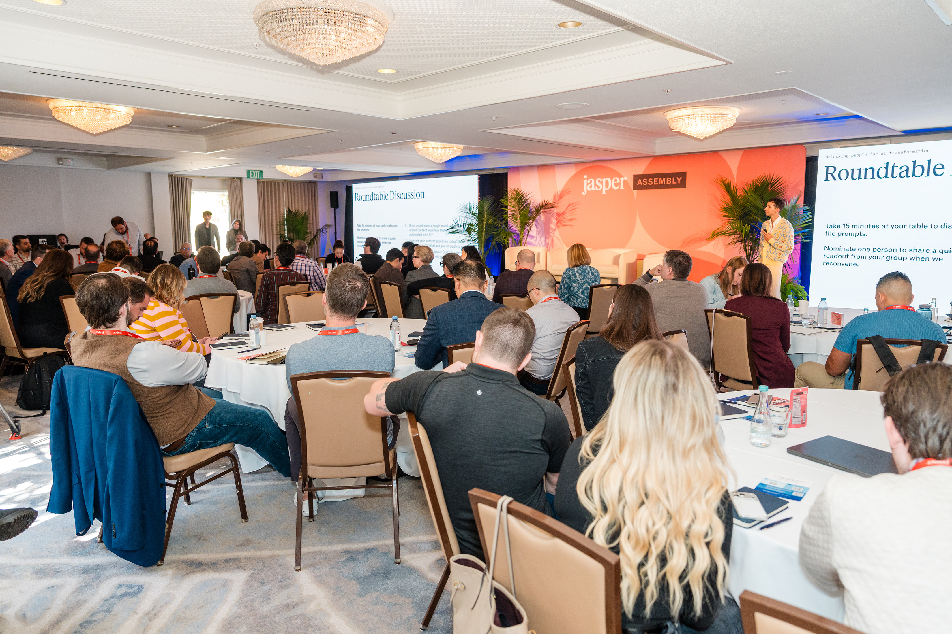Attendees at Jasper Assembly collaborating during roundtable discussions.