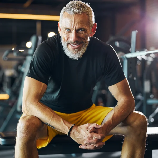 middle-aged man lifting weights
