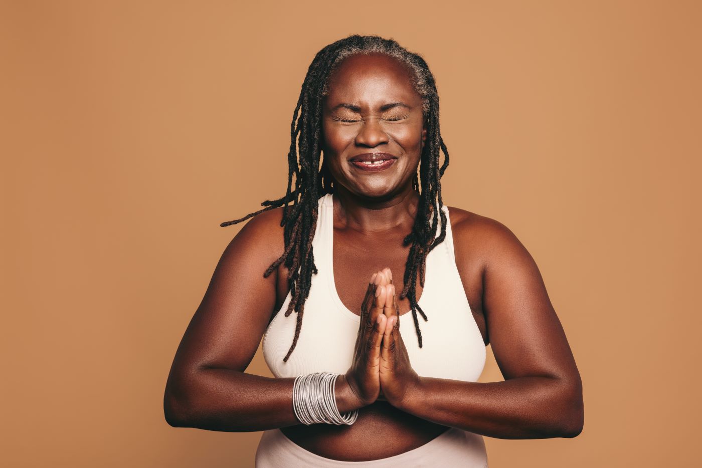 black woman namaste