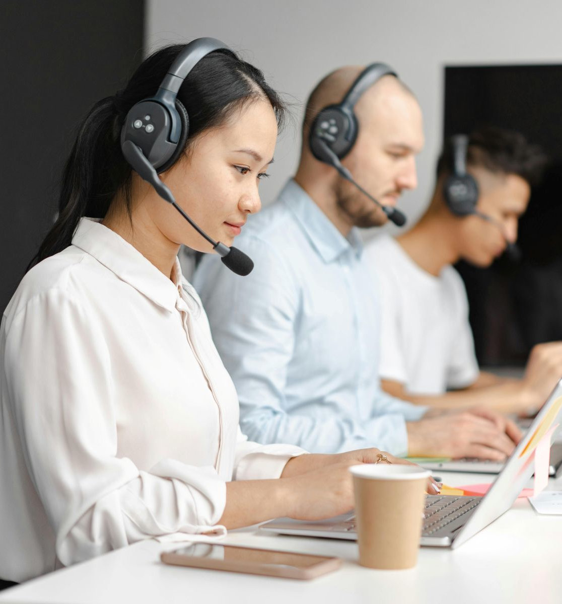 employees with headsets working