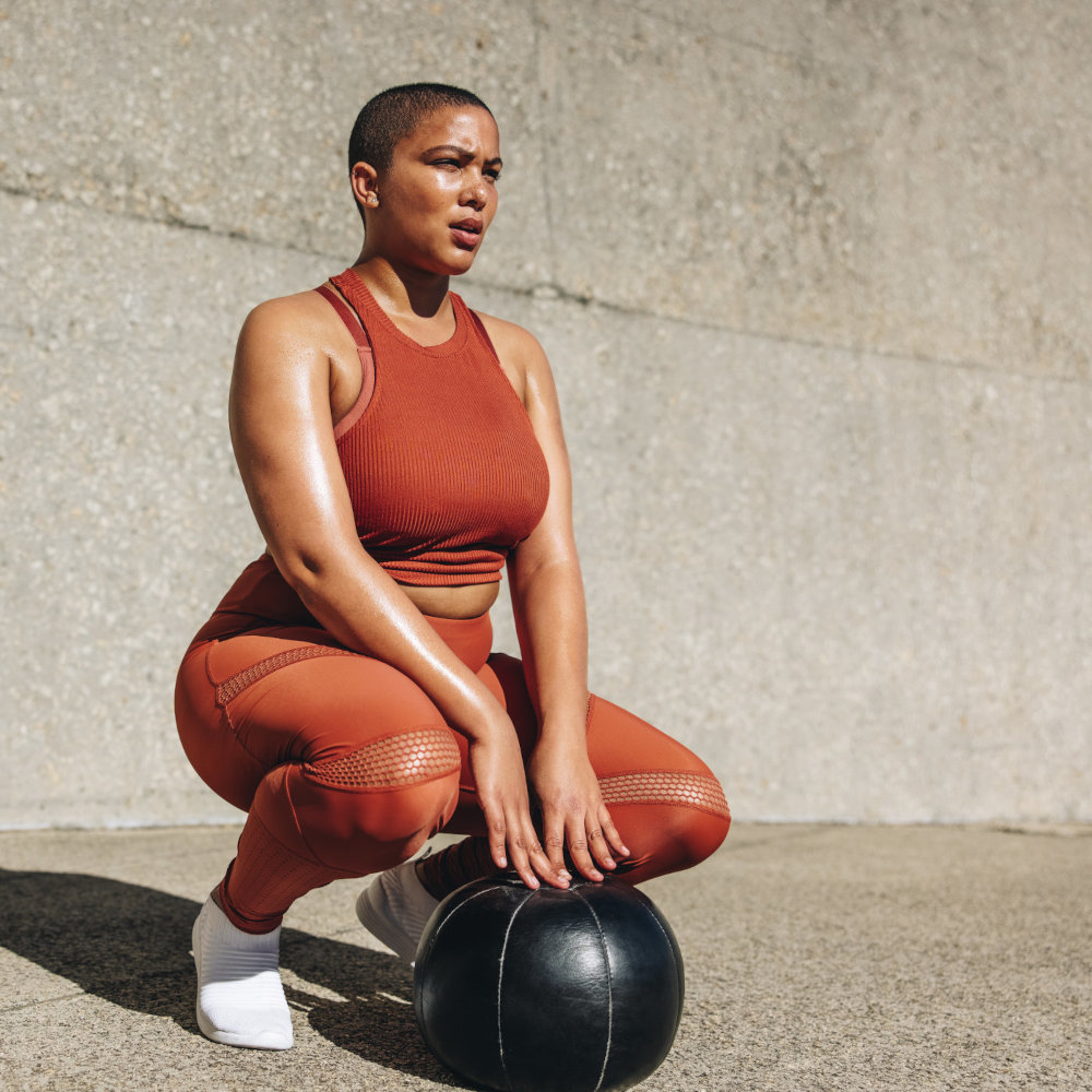 Woman exercising with medicine ball