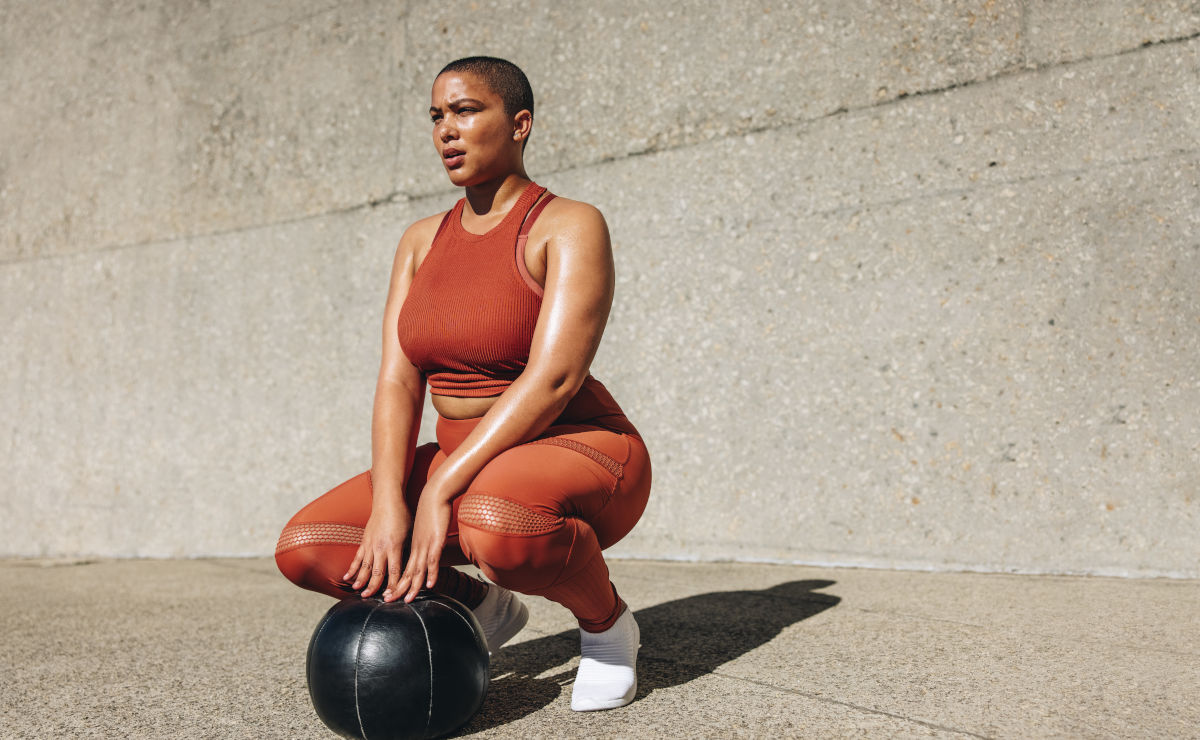 Woman exercising with medicine ball.
