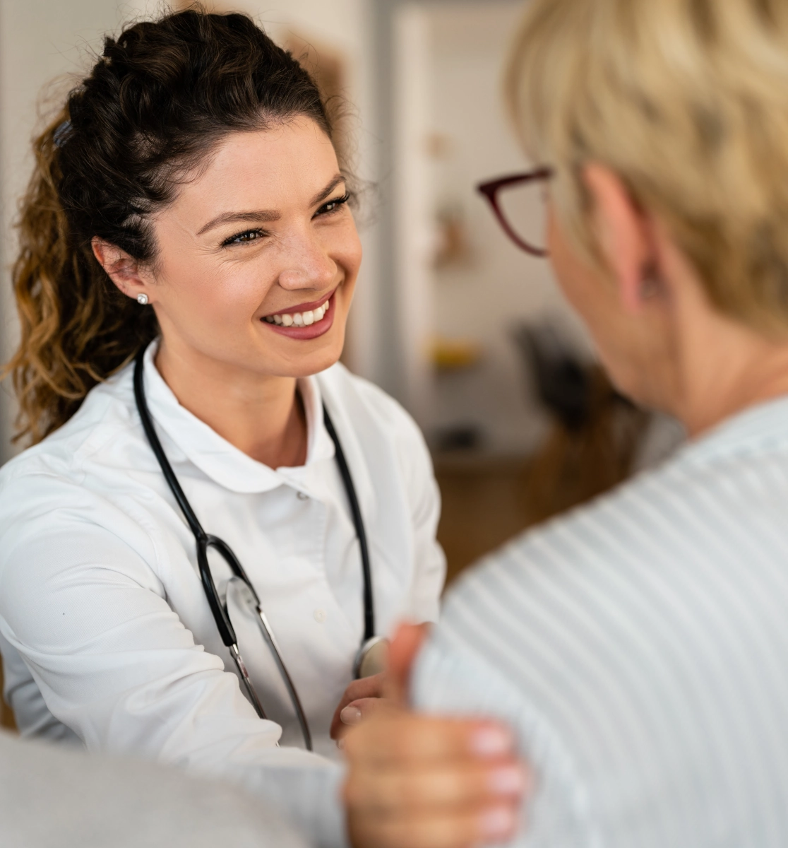 doctor padding a patient
