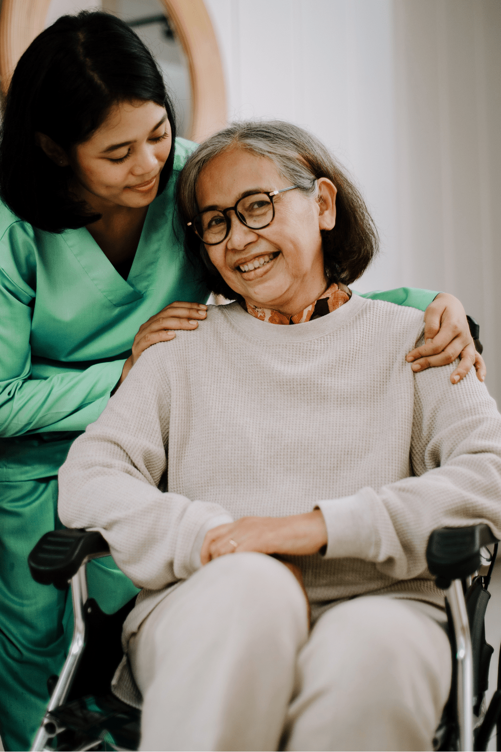 Advanced Wound Care PA-C caring for a smiling elderly woman in a wheelchair