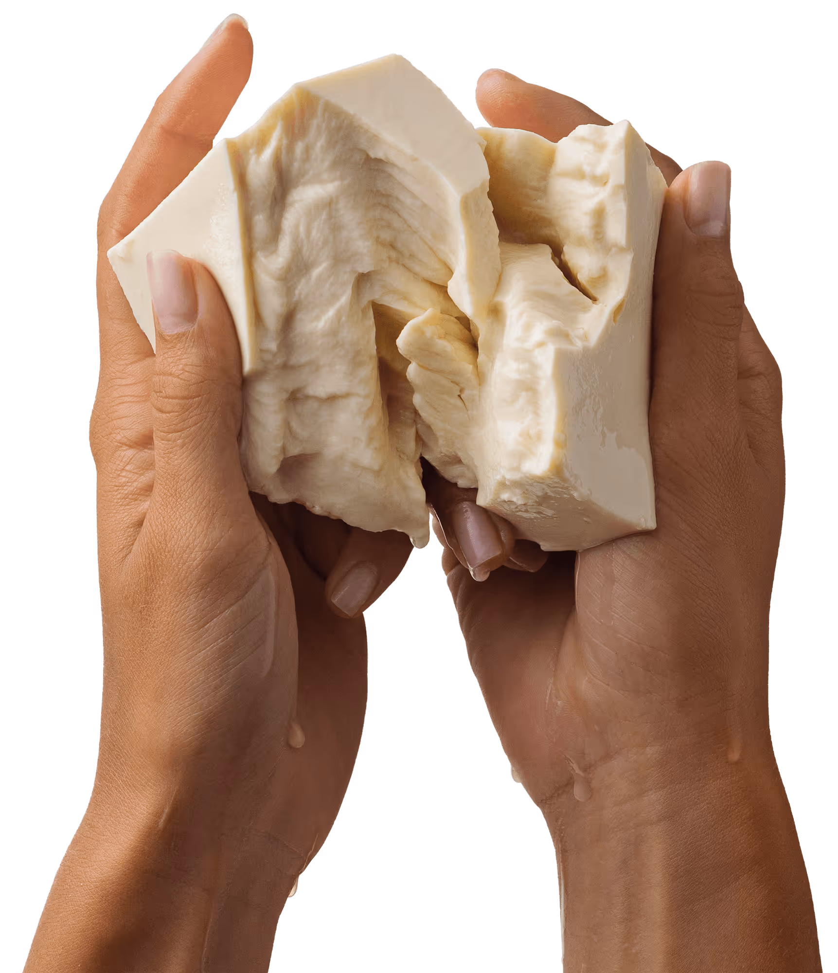A piece of soy being broken by a pair of hands