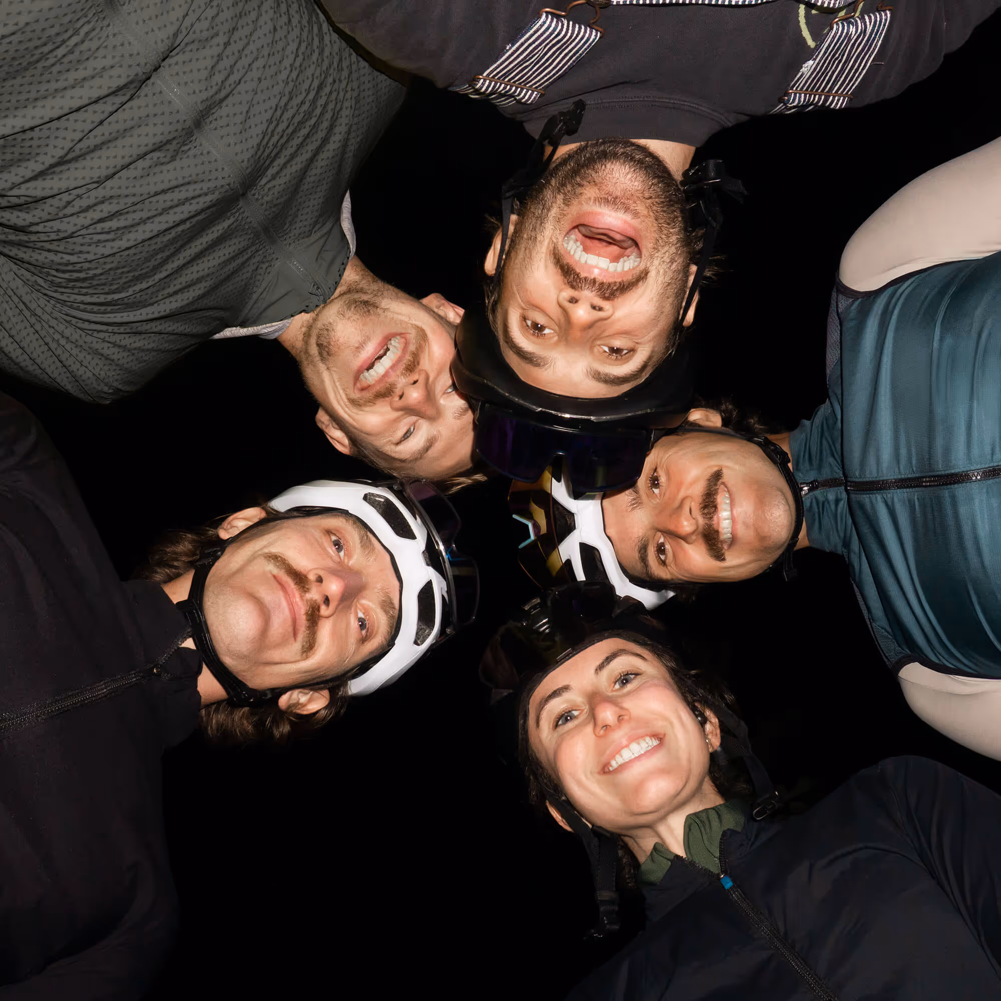 A group of riders looking down at camera