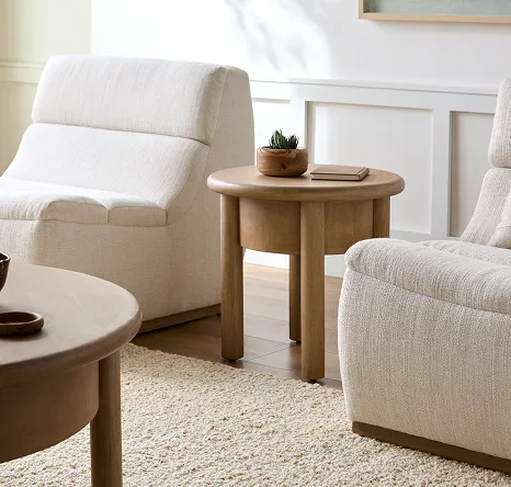 White accent chairs and light brown side table 