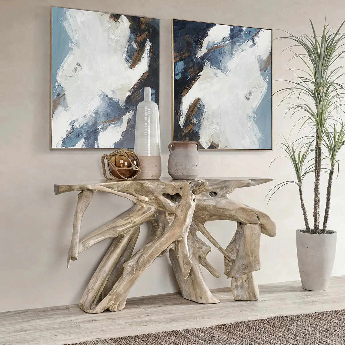 Two blue paintings and wooden dresser made of tree branches