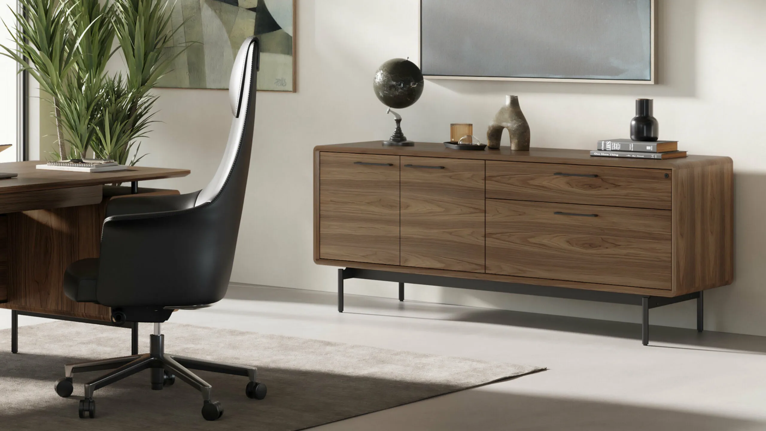 BDI brown dresser with BDI black office chair in corner view