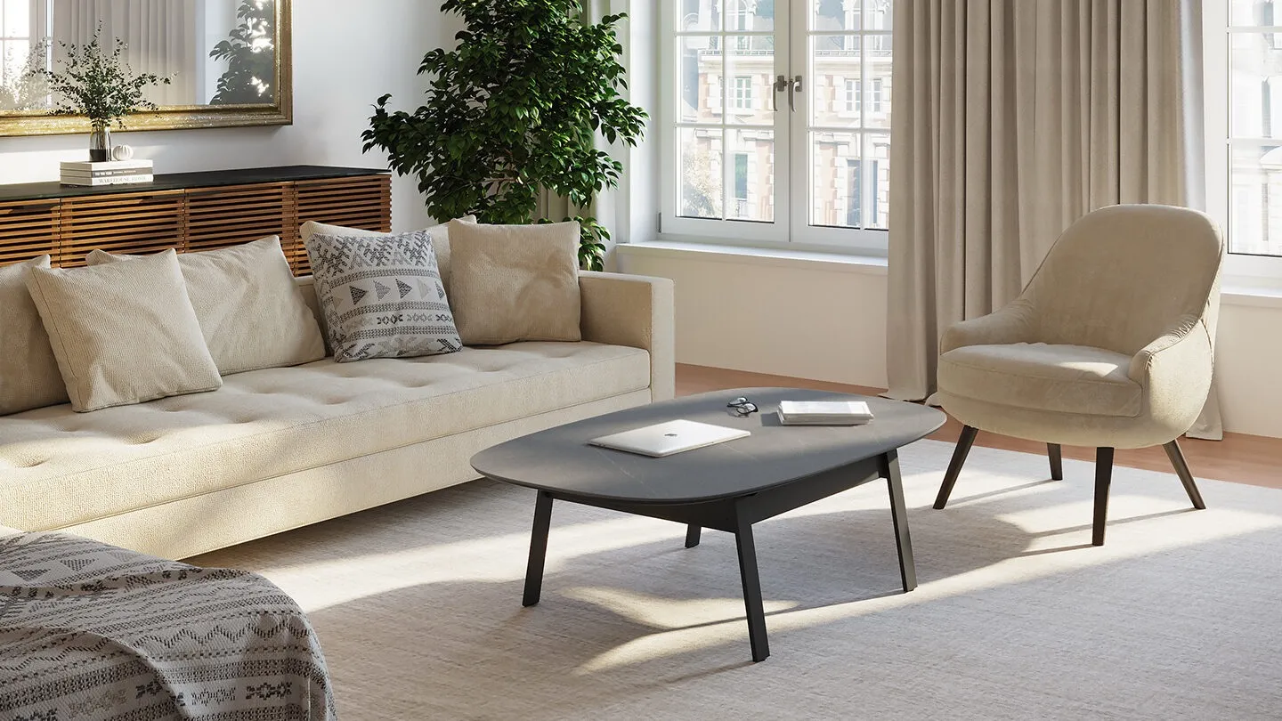 BDI round coffee table next to white sofa and white chair in living room 