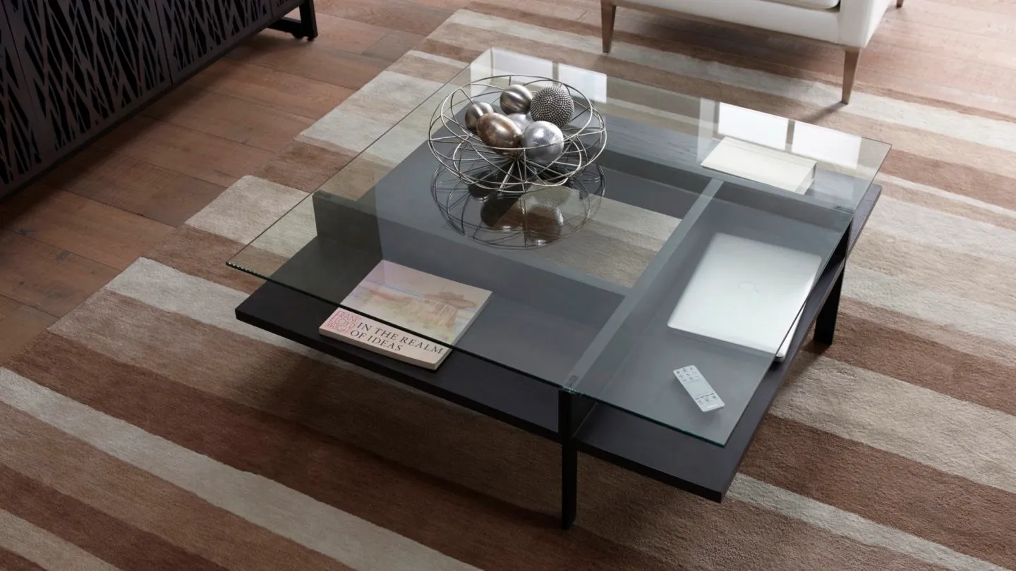 BDI square coffee table on striped brown and white rug 