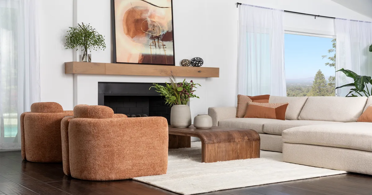 Living room with beige sofa and two light brown chairs 