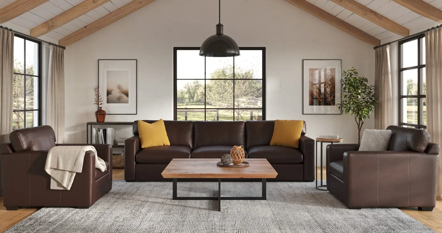 Three dark brown leather sofas by Palliser with yellow pillows