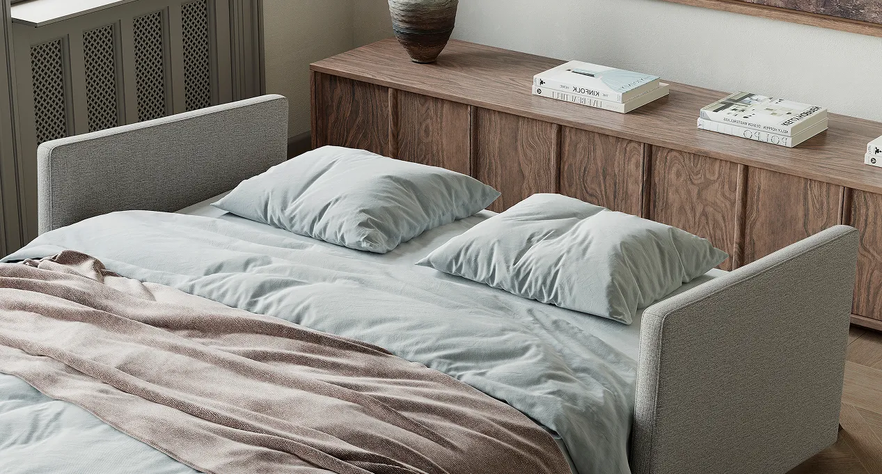 Sleeper sofa with white bedding and white pillows
