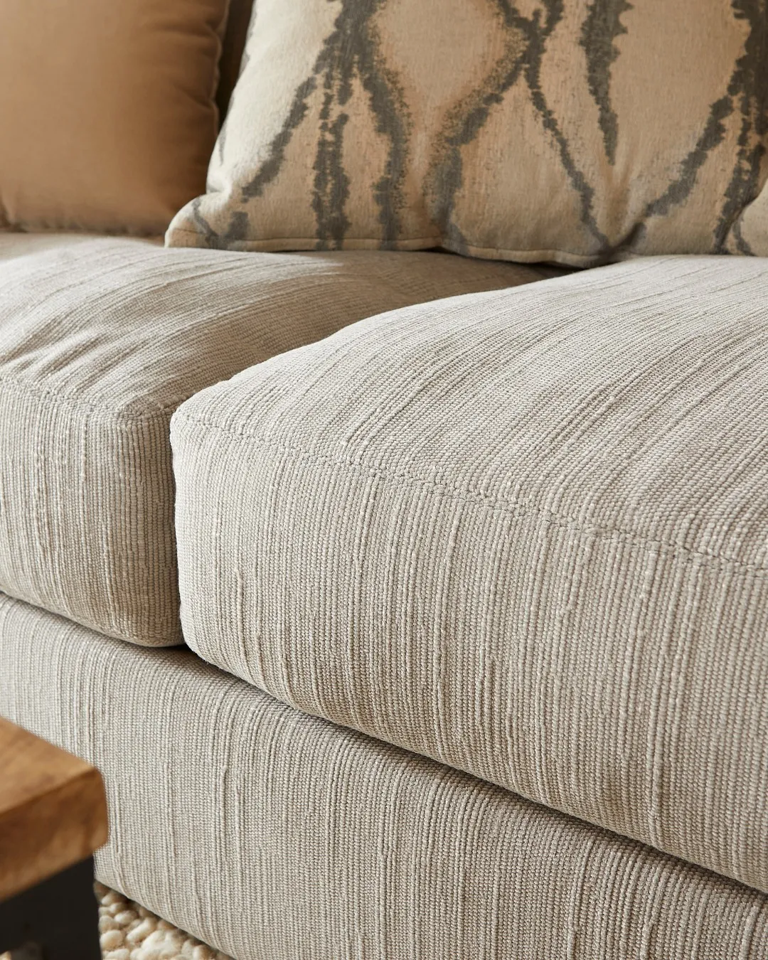 Close up of grey sofa cushions to show fabric 