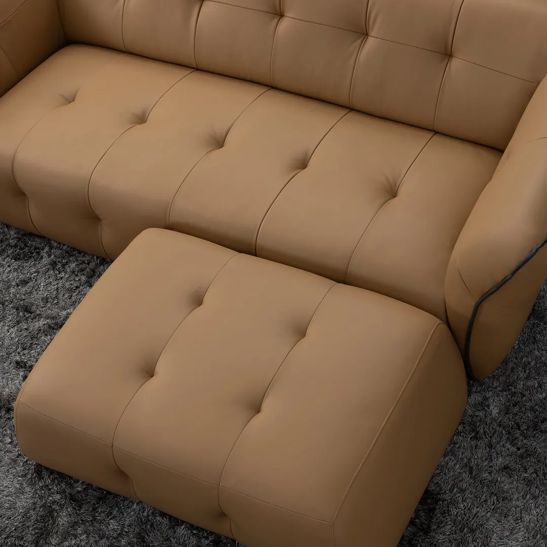 Light brown leather ottoman next to light brown leather sofa
