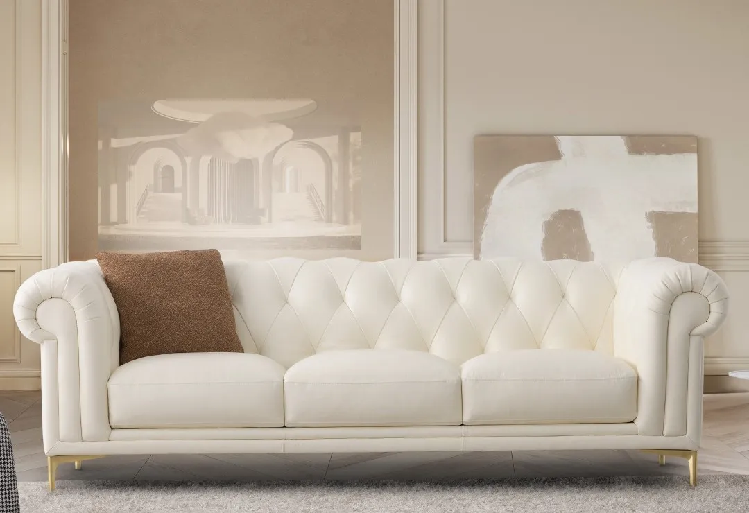 HTL white sofa with curved arm rests and brown pillow 