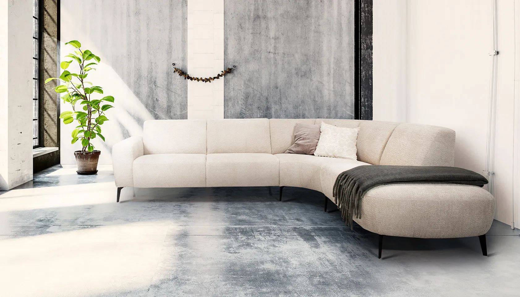 White sectional with brown throw blanket 