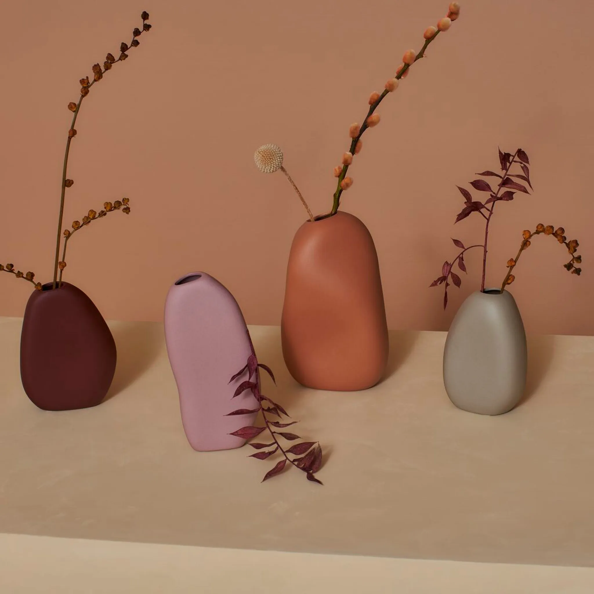 These stoneware vases come in several organic shapes and colours to add a charming decorative display to your space.
