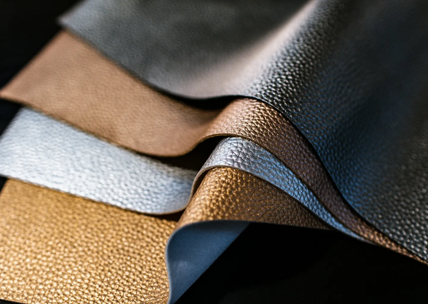 Four different colors of leather swatches