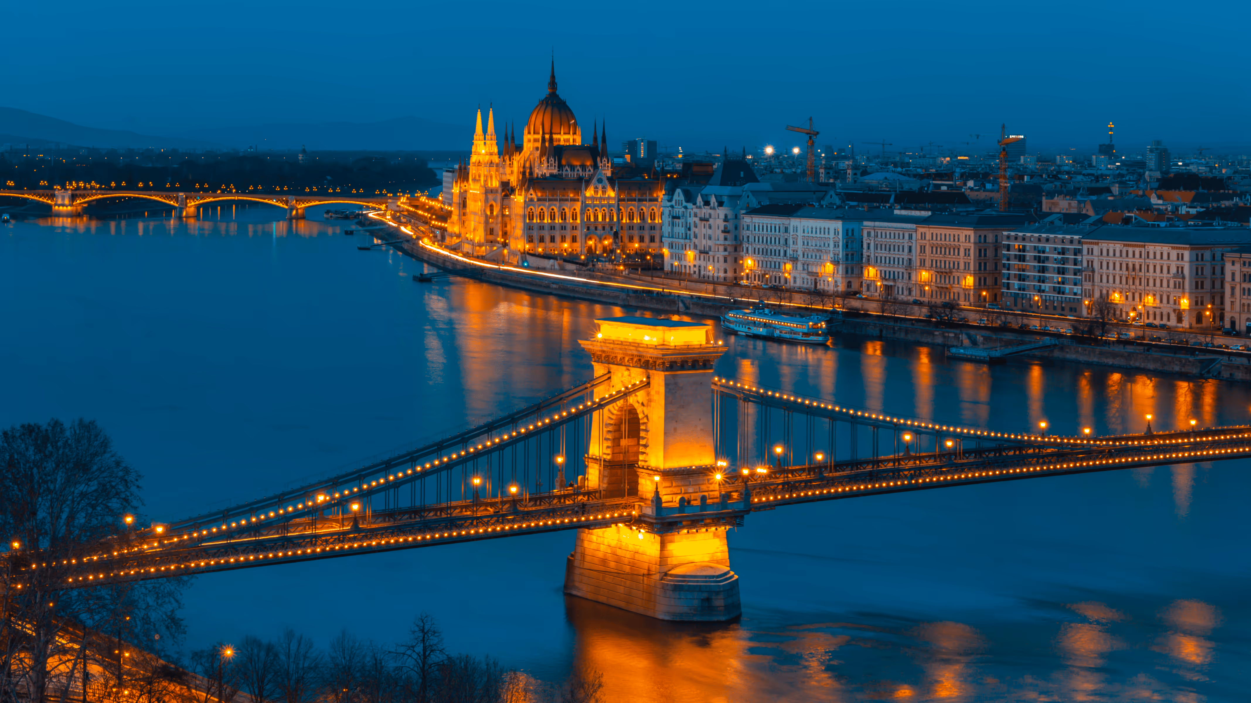 Budapest evening panorama - Illuminated Chain Bridge and Parliament Building along the Danube, Hungarian Golden Visa Program