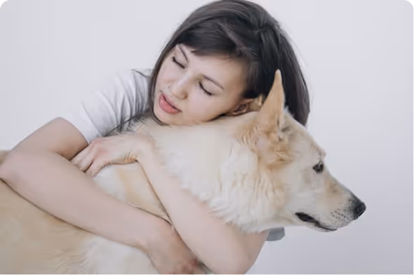 Dog sitting beside woman during somatic therapy for anxiety and PTSD