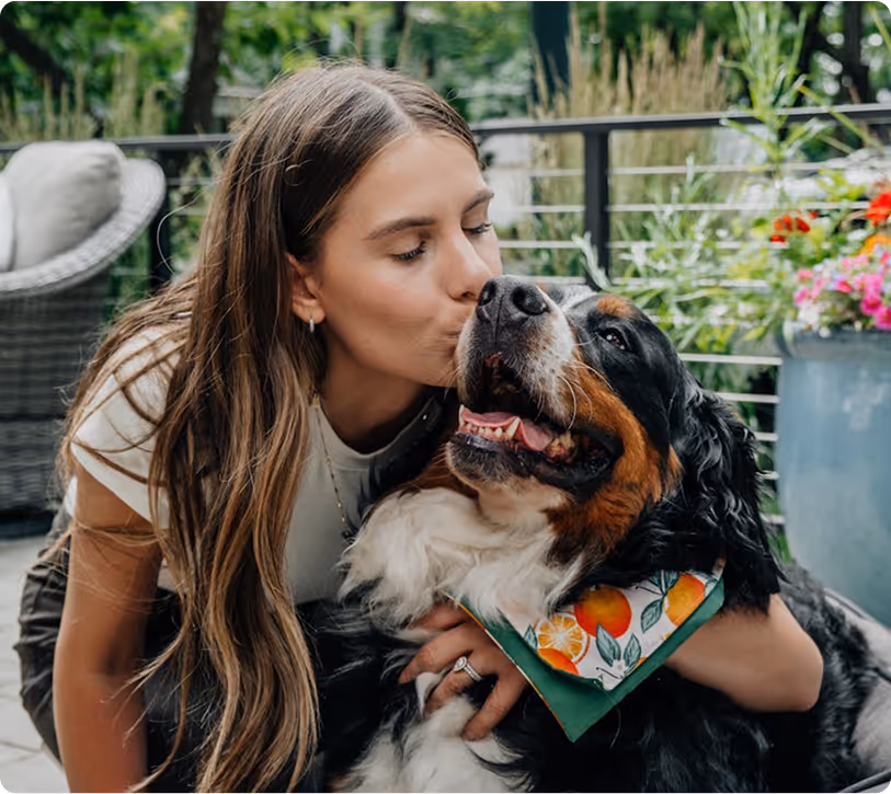 Woman engaging in nature-based trauma therapy with ESA dog support