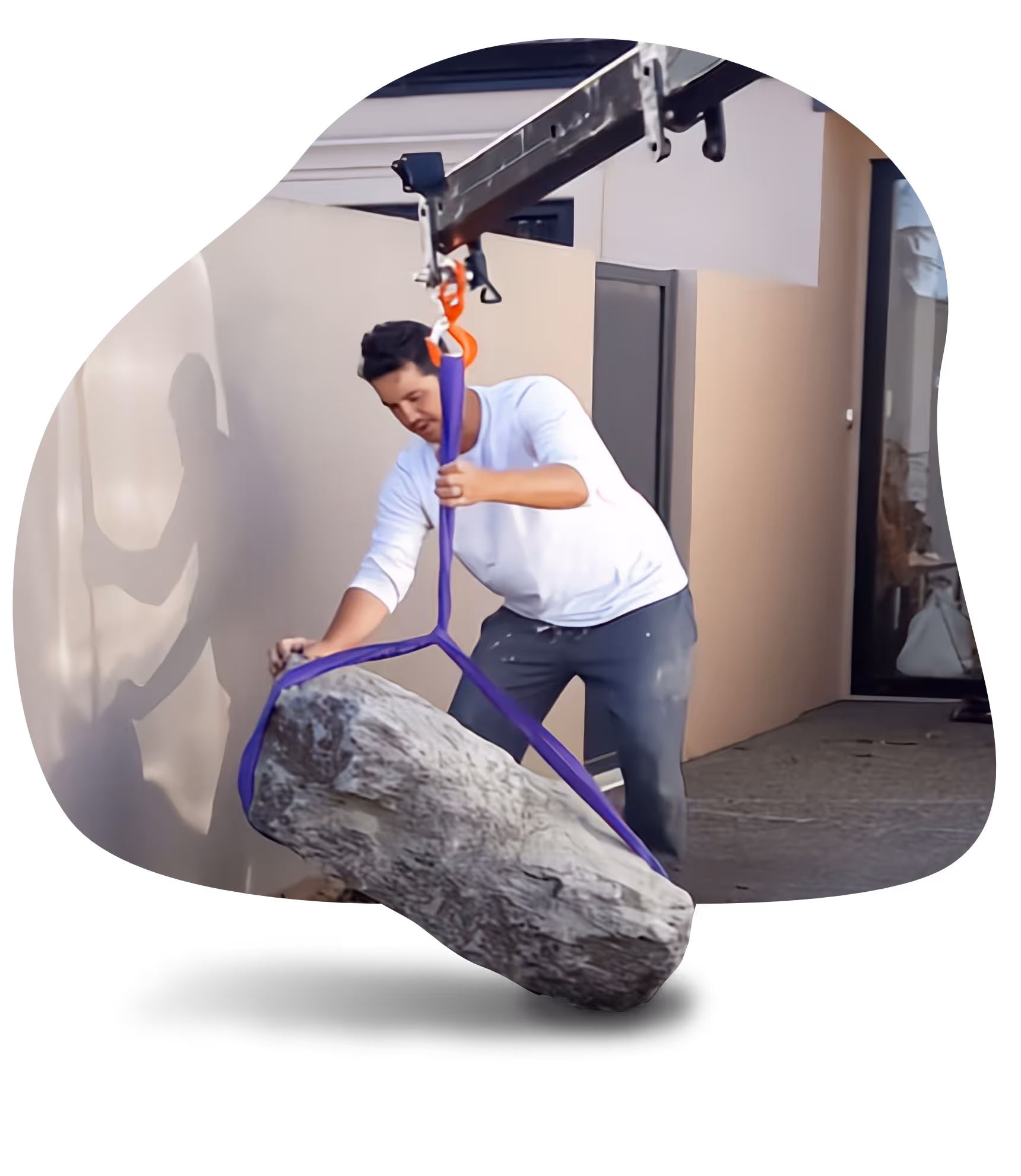 Man positioning rock with hyab. 
